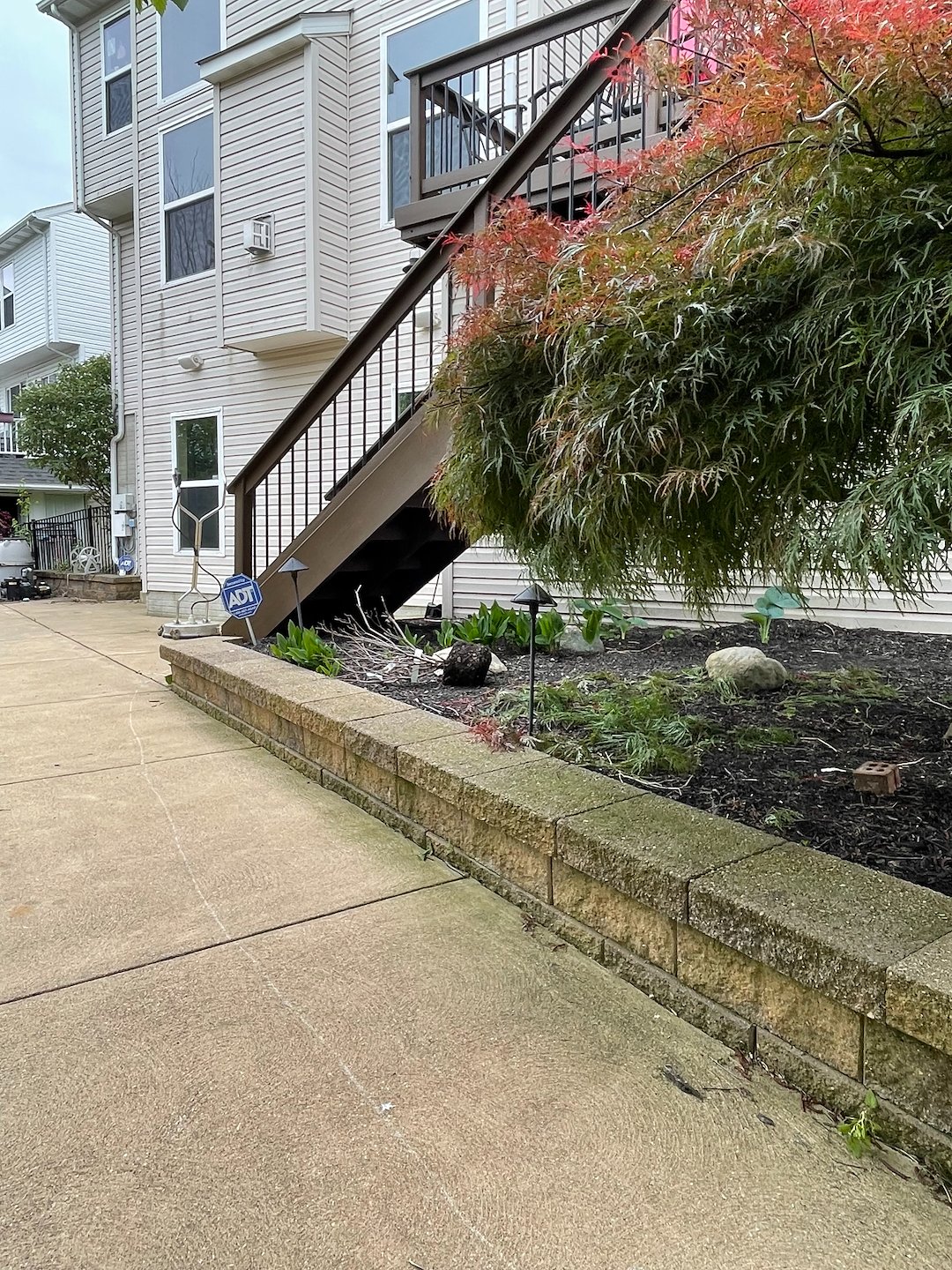 Brunswick Residential Pressure Washing Project Featuring House Washing, Pool Deck Cleaning, Retaining Wall Cleaning, and Concrete Cleaning