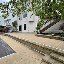 Brunswick-Residential-Pressure-Washing-Project-Featuring-House-Washing-Pool-Deck-Cleaning-Retaining-Wall-Cleaning-and-Concrete-Cleaning 1