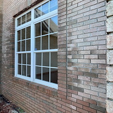 Residential-Pressure-Washing-Removing-Algae-and-Moss-From-Brick-Window-Ledges-on-a-North-Royalton-Home 0
