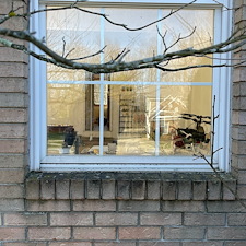 Residential-Pressure-Washing-Removing-Algae-and-Moss-From-Brick-Window-Ledges-on-a-North-Royalton-Home 1