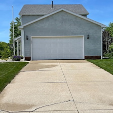 Stow-Residential-Pressure-Washing-for-Green-Siding-and-Black-Concrete-Stains 0