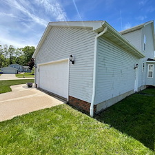 Stow-Residential-Pressure-Washing-for-Green-Siding-and-Black-Concrete-Stains 1